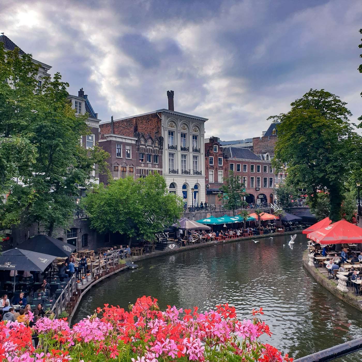 The Oudegracht canal in Utrecht with café terraces on its wharf level